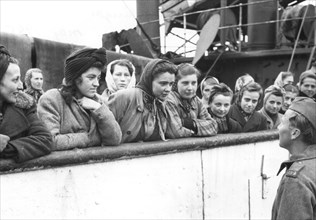 Women talking to a soldier, Trelleborg harbour, Sweden, May 1945. Artist: Unknown