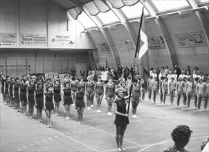Female gymnasts parade in a gymnasium, Swedish National Day, Trelleborg, Sweden, 1969. Artist: Unknown
