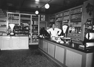 Owner Magnus Påhlsson in his grocer's shop, Sweden, 1943. Artist: Unknown
