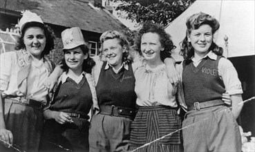 Land Army Girls outside Woodhill Road Hostel, Collingham, Nottinghamshire, c1947-1950. Artist: Unknown