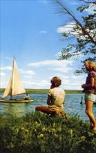 Two women watching a sailing boat on a lake, Michigan Water Wonderland, USA, 1955. Artist: Unknown