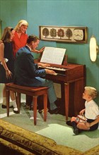 Family with a Wurlitzer 4040 organ, De Kalb, Illinois, USA, 1964. Artist: Unknown