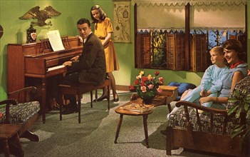 Family with a Wurlitzer model 2620 piano, USA, 1964. Artist: Unknown