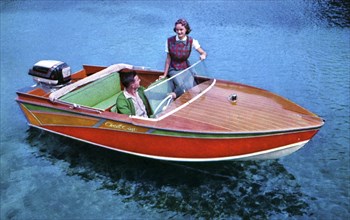 A man and woman in a Carter Craft wooden motor boat, Silver Springs, Florida, USA, 1956. Artist: Unknown