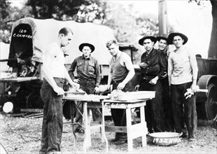Troops of the 61st Cavalry Artillery preparing food on a hike, Illinois, USA, 1932. Artist: Ekmark Photo