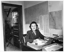 A WAC sitting at a desk in an office, Fort Sheridan, Illinois, USA, 1945. Artist: Unknown
