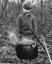 Gypsy boy with cauldron, 1960s.