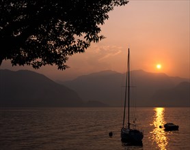 Yacht at sunset, Lake Maggiore, Italy.