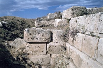 Cuneiform inscriptions on stones, ruined aqueduct, Jerwan, Iraq, 1977.