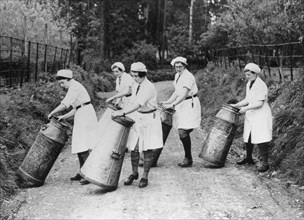 Women churning milk, c1940s(?). Artist: Unknown