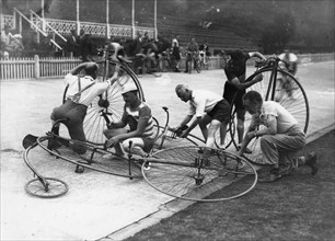 Men working on penny-farthings at a velodrome, c1900-1939(?). Artist: Unknown