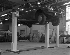 Rover P6 on a Laycock 4 post wheel free lift, Sheffield, South Yorkshire, 1968.  Artist: Michael Walters