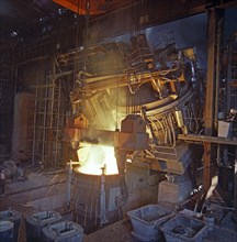 75 ton arc furnace pouring molten steel into a vessel, Sheffield, South Yorkshire, 1969. Artist: Michael Walters