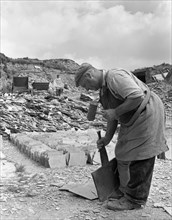 Dressing slate at Trebarwith Slate Quarry, Cornwall, 1959.  Artist: Michael Walters