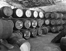 Whisky in barrels at a bonded warehouse, Sheffield, South Yorkshire, 1960.  Artist: Michael Walters