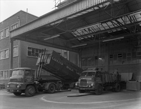 Unloading and loading lorries, Spillers Animal Foods, Gainsborough, Lincolnshire, 1961.  Artist: Michael Walters