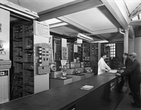 Shop counter, Globe & Simpson auto electrical engineers, Nottingham, Nottinghamshire, 1961.  Artist: Michael Walters