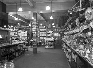 Co-op store showing a sales receipt transfer system, Barnsley, South Yorkshire, 1955. Artist: Michael Walters
