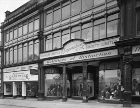 Exterior of the Barnsley Co-op central men's tailoring department, South Yorkshire, 1959. Artist: Michael Walters