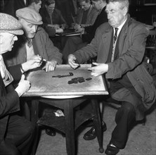 A game of dominoes in a miners' welfare club, Horden, County Durham, 1963. Artist: Michael Walters