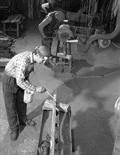 Steel bars being cut to size at J Beardshaw & Sons, Sheffield, South Yorkshire, 1963. Artist: Michael Walters