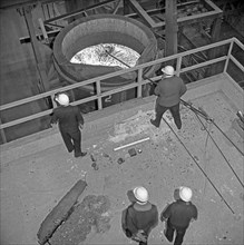 Testing the temperature of molten steel, Park Gate, Rotherham, South Yorkshire, 1964. Artist: Michael Walters