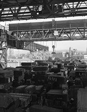 Eectromagnet above steel ingots, Park Gate Iron & Steel Co, Rotherham, South Yorkshire, 1964. Artist: Michael Walters