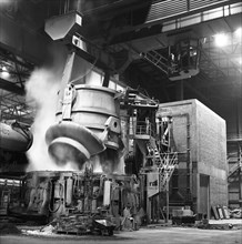Charging a furnace, Park Gate Iron & Steel Co, Rotherham, South Yorkshire, 1964.  Artist: Michael Walters