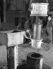 Stripping a steel casting, Wombwell Foundry, South Yorkshire, 1963.  Artist: Michael Walters