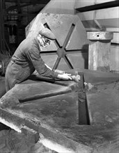 Grinding the flashing from a casting, AT Green & Sons Ltd, Rotherham, South Yorkshire, 1963. Artist: Michael Walters