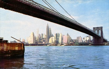 Lower Manhattan skyline from under the Brooklyn Bridge, New York City, New York, USA, 1956. Artist: Unknown