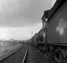 Steam loco no 65811 hauling coal from Lynemouth Colliery, Northumberland, 1963.  Artist: Michael Walters