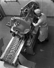 Bacon slicing machine, Danish Bacon Company, Selby, North Yorkshire, 1964. Artist: Michael Walters