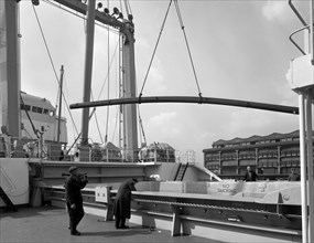 Steel bars being loaded onto the 'Manchester Renown', Manchester, 1964. Artist: Michael Walters