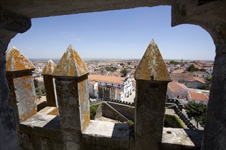 Merlons on the battlements of Beja Castle and view of the city, Beja, Portugal, 2009. Artist: Samuel Magal