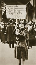 Woman holding a placard in support of the war effort, USA, World War I, c1914-c1918. Artist: Unknown