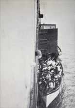 View from the 'Carpathia' of a lifeboat from the 'Titanic' brought alongside, 15 April, 1912. Artist: Unknown