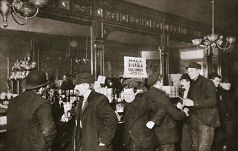 Customers drinking in a bar in the Bowery, New York City, USA, 1900s. Artist: Unknown