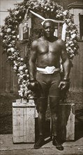 Jack Johnson, American boxer, 1910. Artist: Unknown