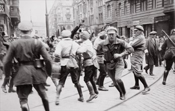 Men in Bolshevik uniform fighting police in the street, Germany, c1918-c1933(?) (1936). Artist: Unknown