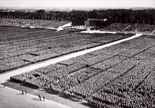 Stormtroopers lined up on parade during a Nazi Party Congress in Nuremberg, Germany, 1936. Artist: Unknown