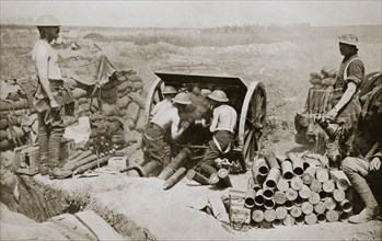 'Hot work at the guns', Somme campaign, France, World War I, 1916. Artist: Unknown
