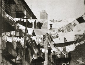Wash day at some New York tenement buildings, USA, early 1930s. Artist: Unknown