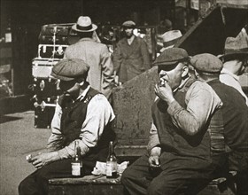 Day labourers having a hot dog and lemonade, Battery Park, New York, USA, early 1930s. Artist: Unknown