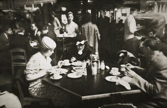 Office workers lunching in a restaurant, New York, USA, early 1930s. Artist: Unknown