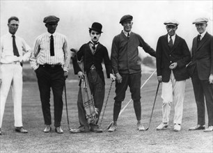 Charlie Chaplin with five members of the Chicago Golf Club, Pasadena, USA, c1920s(?). Artist: Unknown