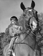 Crown Prince Carl Gustaf of Sweden and his horse, Nivea, Haga Castle, Sweden 1952. Artist: Unknown