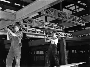 Engineers lifting steelwork into position, South Yorkshire, 1954. Artist: Michael Walters