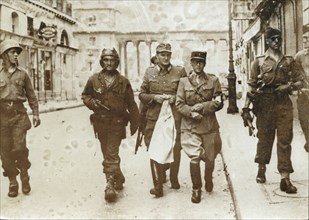 A German officer escorted by French soldiers, the liberation of Paris, World War II, 1944. Artist: Unknown