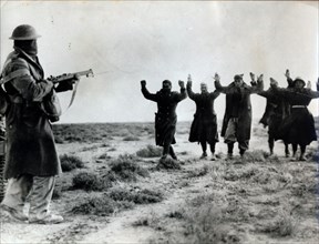 Italian troops surrender to an Australian soldier, Bardia, Libya, World War II, 1941. Artist: Unknown